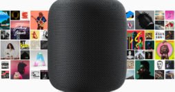 HomePod mit Apple Music Alben im Hintergrund